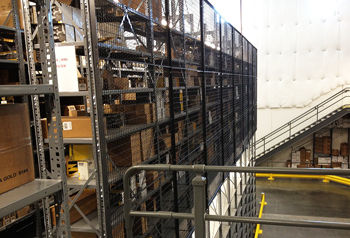 RackBack Safety Panels Mounted on Steel Shelving to Prevent Falling Inventory