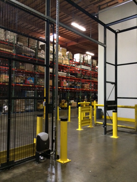 Distribution Center Secured With Pallet Rack Back, Wire Partition & GuardRail