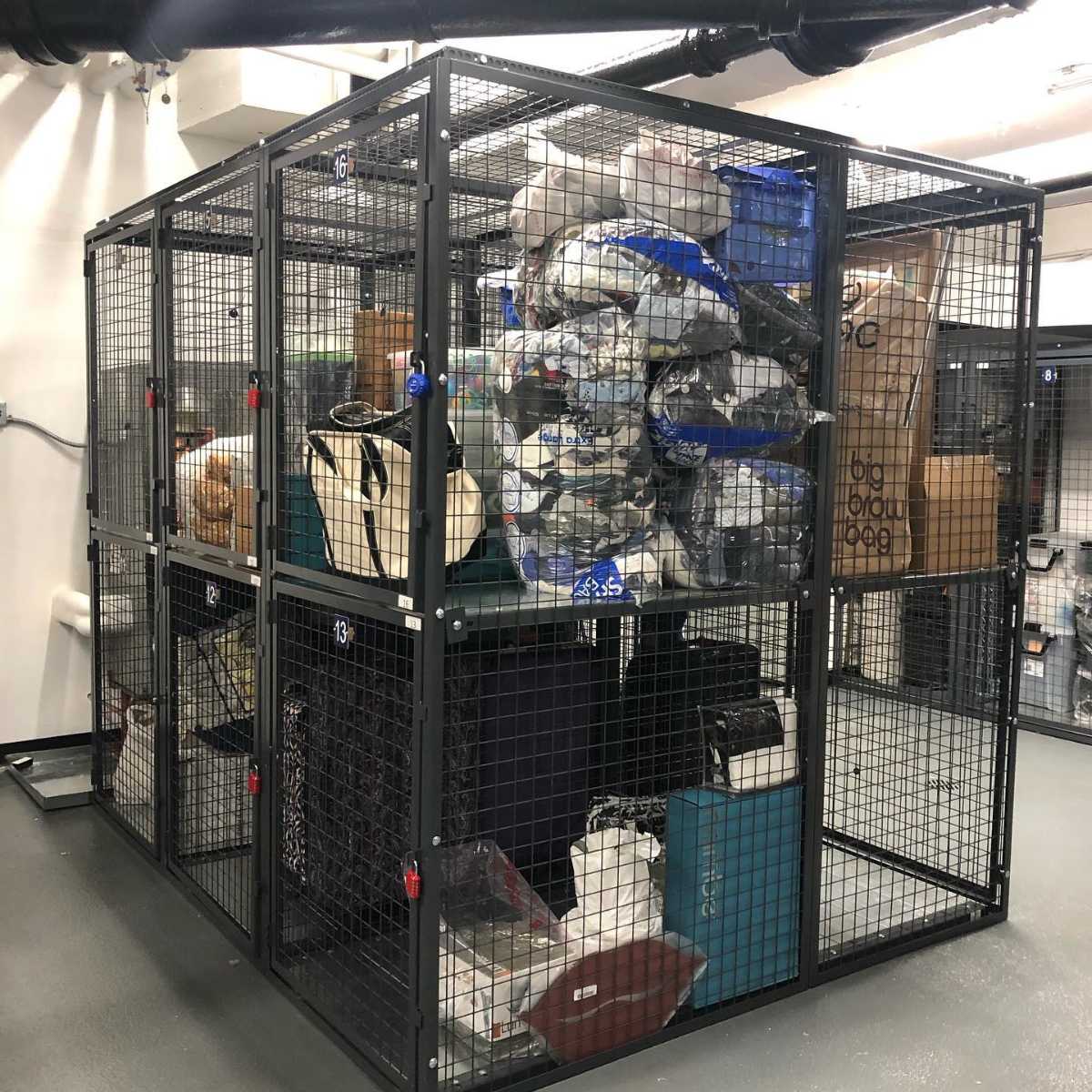 black wire mesh cage with stacked individual storage lockers
