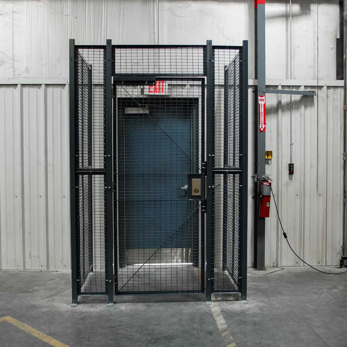 three panel driver cage at building entrance with key lock door