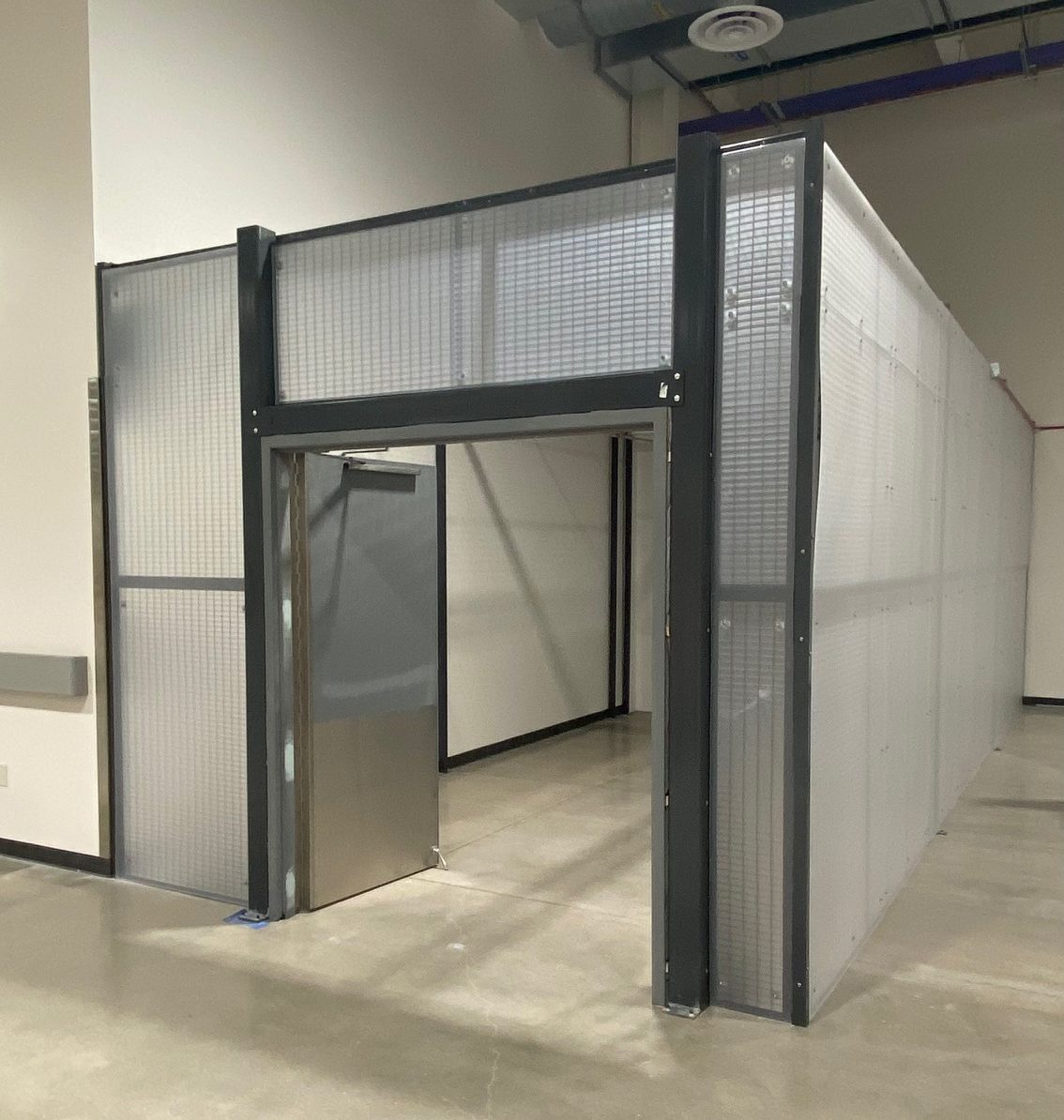 WireCrafters-Wire-Partition-Lynch-Material-Handling-Case-Study Wire Partition Cage for Top Secret Project